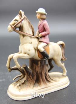 Collection of Porcelain Horse Figurines in Various Poses, Colors, and Sizes