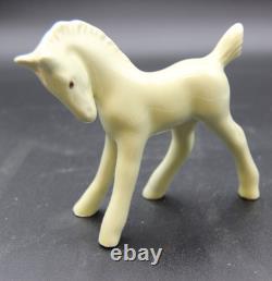 Collection of Porcelain Horse Figurines in Various Poses, Colors, and Sizes