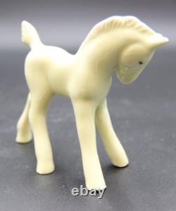 Collection of Porcelain Horse Figurines in Various Poses, Colors, and Sizes