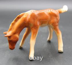 Collection of Porcelain Horse Figurines in Various Poses, Colors, and Sizes