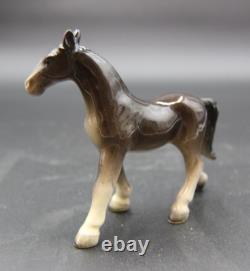 Collection of Porcelain Horse Figurines in Various Poses, Colors, and Sizes
