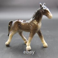 Collection of Porcelain Horse Figurines in Various Poses, Colors, and Sizes