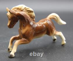 Collection of Porcelain Horse Figurines in Various Poses, Colors, and Sizes