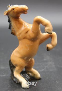 Collection of Porcelain Horse Figurines in Various Poses, Colors, and Sizes