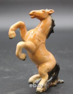 Collection of Porcelain Horse Figurines in Various Poses, Colors, and Sizes