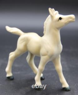 Collection of Porcelain Horse Figurines in Various Poses, Colors, and Sizes