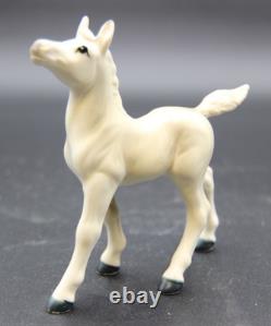 Collection of Porcelain Horse Figurines in Various Poses, Colors, and Sizes