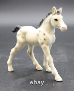 Collection of Porcelain Horse Figurines in Various Poses, Colors, and Sizes