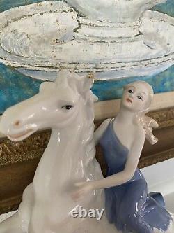 Lady and horse figurine
