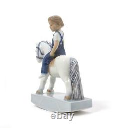 Porcelain figurine Boy on rocking horse. Denmark, Royal Copenhagen #5651