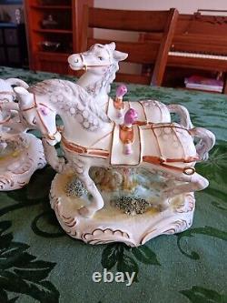 Porcelain horse-drawn carriage and 3 Sets Of Horses. Purchased In 1999 In Romani