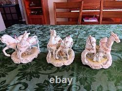 Porcelain horse-drawn carriage and 3 Sets Of Horses. Purchased In 1999 In Romani