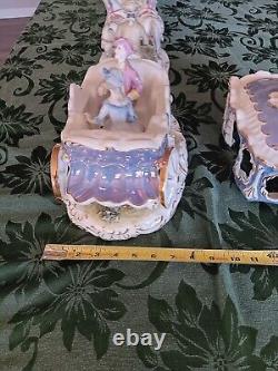 Porcelain horse-drawn carriage and 3 Sets Of Horses. Purchased In 1999 In Romani